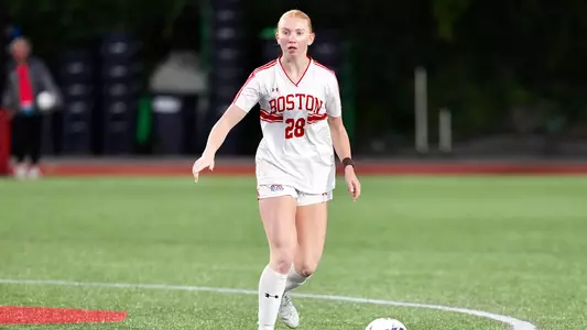 Photo of BU women's soccer freshman JJ Marzot dribbling the ball at Nickerson Field.