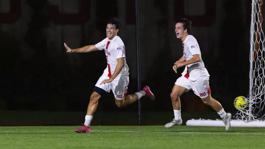 Andrea Di Blasio stretches out his arms while running after scoring BU's third goal against Brown