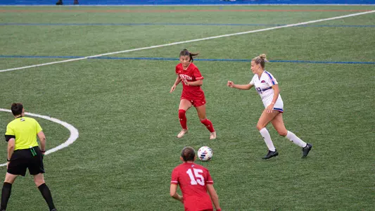 Photo of women's soccer freshman Nina Tzouganatos playing defense at UMass Lowell.