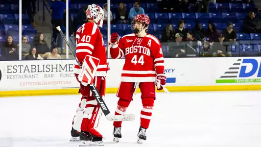 Mikhail Yegorov and Cole Hutson Fist Bumping