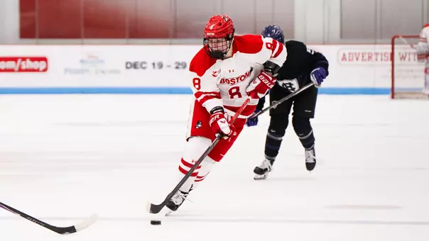 Lola Reid playing Hockey against Holy Cross