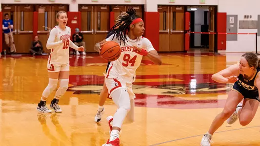 Photo of BU women's basketball junior Sisi Bentley dribbling the ball at Case Gym.