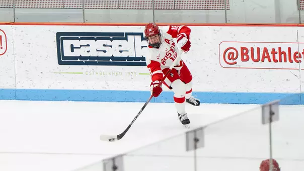 Neely Nicholson passing the puck at Walter Brown Arena