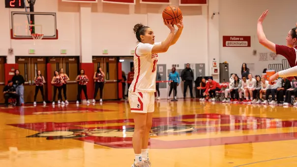 Photo of BU women's basketball sophomore Rose Azmoudeh shooting a three-pointer at Case Gym.