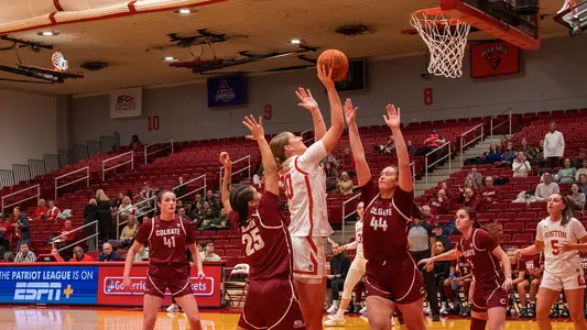 Photo of BU women's basketball senior Anete Adler shooting a layup against Colgate.