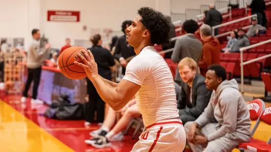 Donte Tisinger prepares to take a shot during warm-ups