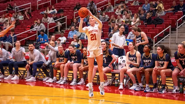 Photo of BU women's basketball junior Audrey Ericksen shooting a three-pointer against Navy.
