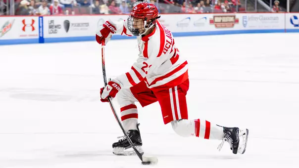 Owen McLaughlin shooting a puck