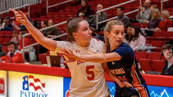 Photo of BU women's basketball junior Aoibhe Gormley aboutto receive and inbound pass at Case Gym.