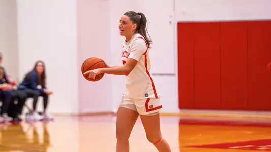 Photo of BU women's basketball junior Aoibhe Gormley dribbling the ball at Case Gym.