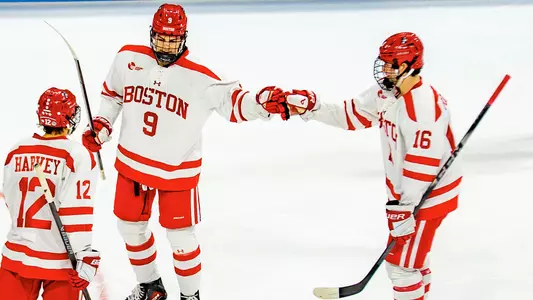Sacha Boisvert and Conrad Fondrk celebrate a goal