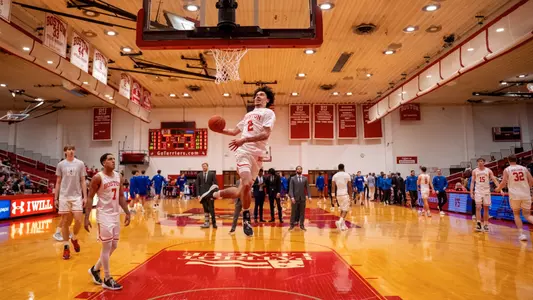 Chance Gladden jumps up for a slam dunk during warmups.