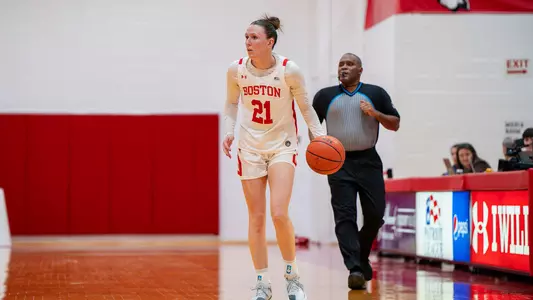 Photo of BU women's basketball captain Audrey Ericksen dribbling the ball at Case Gym.