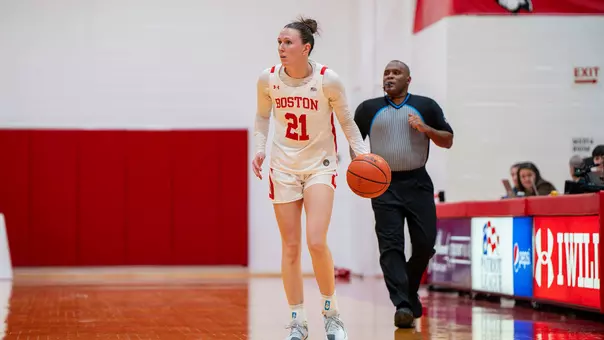 Photo of BU women's basketball captain Audrey Ericksen dribbling the ball at Case Gym.
