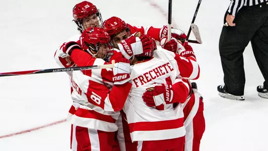 BU men's hockey players celebrate a goal against Brown