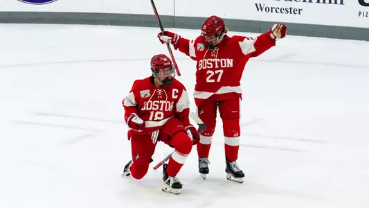 Neely Nicholson and Keira Healey celebrate scoring a goal at Holy Cross