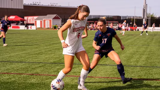 Photo of BU women's soccer senior Sam Aronson controlling possession.