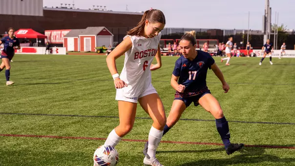 Photo of BU women's soccer senior Sam Aronson controlling possession.