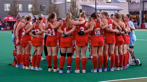 Field hockey huddle vs. Holy Cross