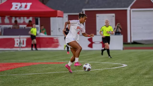 Photo of BU women's soccer sophomore Ariana Schwinn-Clanton dribbling the ball at Nickerson Field.