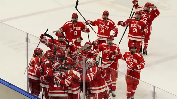 BU men's ice hockey team celebrates after Tynan Lawrence's overtime goal