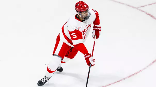 Carter Amico playing hockey for BU
