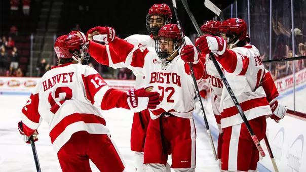 BU men's hockey players celebrate a goal against Maine