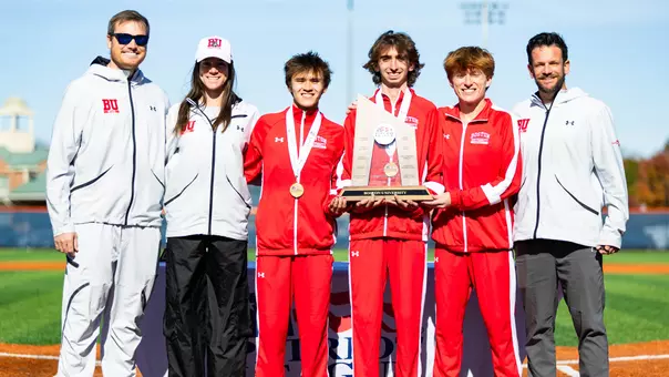 BU men's cross country athletes and coaches pose with Patriot League runner-up trophy