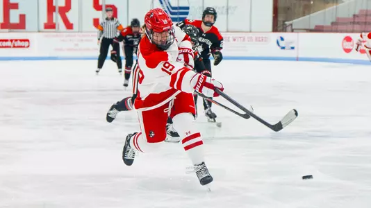 Clara Yuhn shooting the puck at Walter Brown Arena