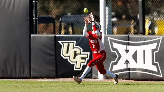 Camryn Lyons makes a catch in the outfield while on the run