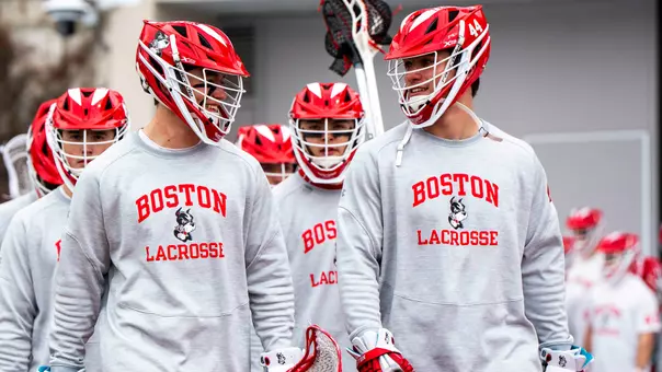 Connor Kehm and Jimmy Kohr walk out to Nickerson Field before a game