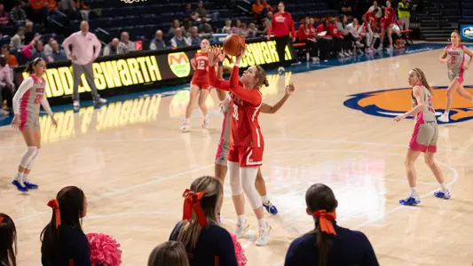 Photo of BU women's basketball senior Anastasiia Semenova shooting a layup at Bucknell.