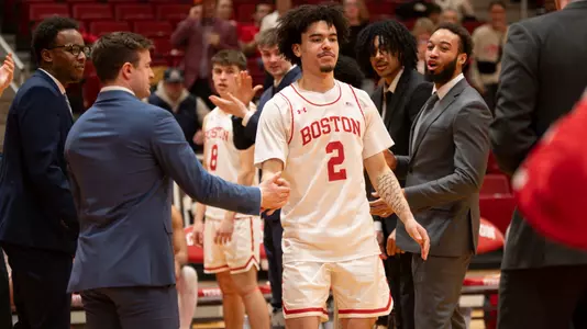 Chance Gladden hits hands with teammates during lineup announcement
