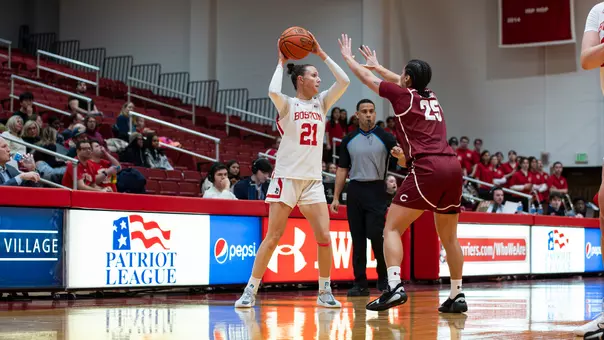 Photo of BU women's basketball junior Audrey Ericksen looking to pass the ball.