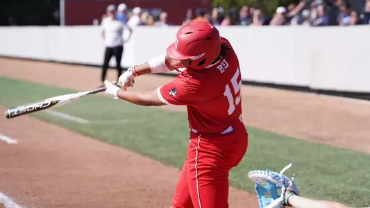 Irys Kline swings the bat hitting left handed at the plate.