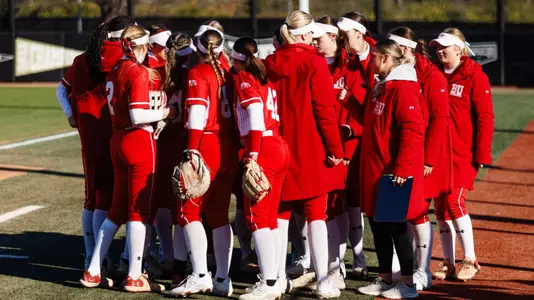 BU softball team huddles together at the UCF Black & Gold Classic
