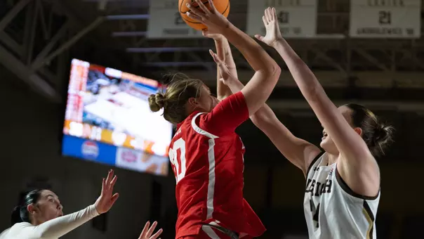 Photo of BU women's basketball senior Anete Adler passing the ball at Lehigh.