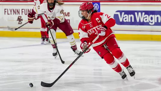 Maeve Carey skating with the puck at Boston College