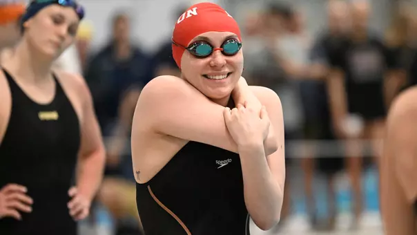 Haley Newman smiles on deck in preparation for the 400 IM final