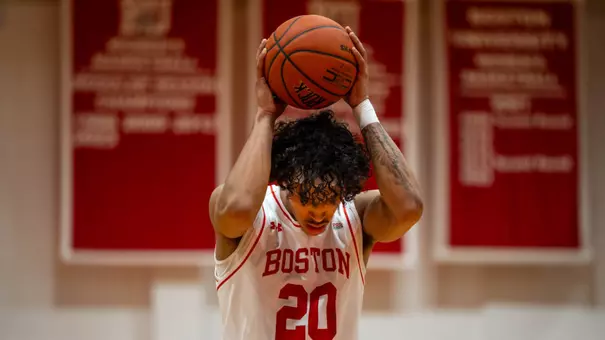 Michael McNair places the basketball over his head before attempting a free throw