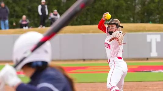 Haley Ganino is in the middle of her pitching motion toward home plate