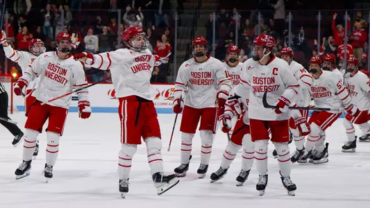 Ryder Ritchie celebrates with his teammates after his OT goal against Maine