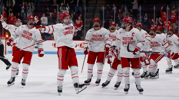 Ryder Ritchie celebrates with his teammates after his OT goal against Maine