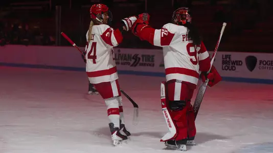 Maeve Kelly and Mari Pietersen fist bump celebrating a win