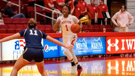 Photo of BU women's basketball sophomore Taylor Williams dribbling the ball at Case Gym.