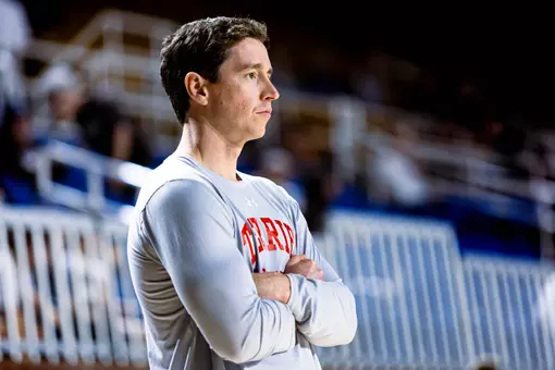Associate head coach Mike Quinn at warmups for the Patriot League championship.