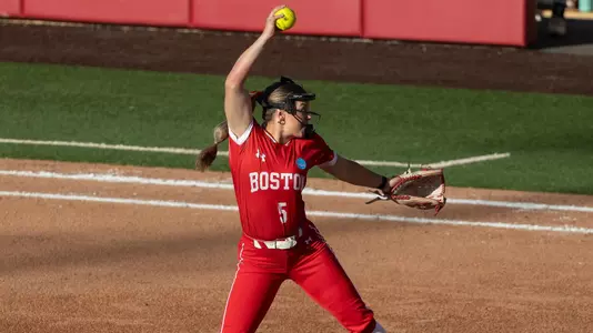 Photo is taken from the side of Haley Ganino going through her pitching motiion