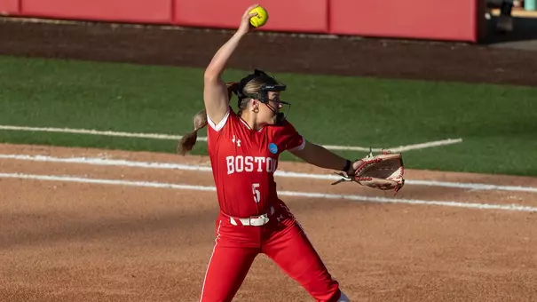 Photo is taken from the side of Haley Ganino going through her pitching motiion