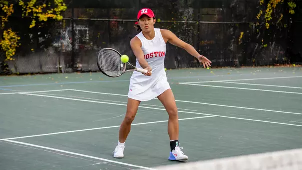 Nancy Liu hitting a volley at the net