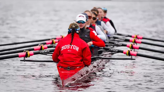 Photo of a BU Lightweight Rowing eight practicing on the Charles River.